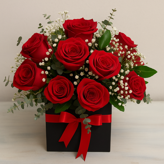 box of roses with white gypsophila